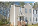 Attractive townhouse featuring a quaint front porch and tidy landscaping at 7099 Skippingstone Way, Douglasville, GA 30134
