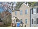 Charming two-story townhouse with light-colored siding, and a cozy front entrance at 7099 Skippingstone Way, Douglasville, GA 30134