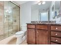 Bathroom features marble vanity with tile shower, updated fixtures and spacious vanity at 1280 W Peachtree Nw St # 3514, Atlanta, GA 30309