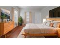 Inviting bedroom with a hardwood floors, with a wooden bed frame and a dresser at 1453 Graham Sw St, Atlanta, GA 30310