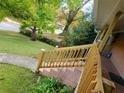 View of the exterior steps leading to the front porch and yard at 1723 Fort Valley Sw Dr, Atlanta, GA 30311