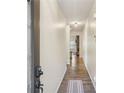 Inviting hallway with hardwood floors and a modern light fixture at 426 Mulberry Se Row, Atlanta, GA 30354
