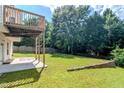 Backyard view showcasing a patio and under-deck area, ideal for relaxing outdoors at 851 Roget Ct, Lawrenceville, GA 30045
