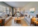 Spacious living room featuring a plush rug, comfortable seating, and a view into the dining room at 1555 Rupert Rd, Decatur, GA 30032