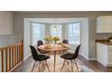 Cozy dining nook with bay window offers natural light and wood flooring at 2105 Sandtree Sw Ct, Atlanta, GA 30331