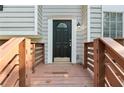Close-up of a welcoming front door with decorative glass and wooden railings, inviting you to step inside at 2920 Cushing Ct, Jonesboro, GA 30236