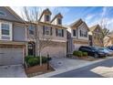 Beautiful townhome with brick details, two-car garage, tidy landscaping, and stylish curb appeal at 5008 Whiteoak Pointe Se # 15, Smyrna, GA 30080