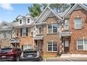 Attractive brick townhome exterior with detailed trim and parking at 2372 Johnson Rd, Atlanta, GA 30345