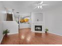 Inviting living room with a cozy fireplace and gleaming hardwood floors at 2372 Johnson Rd, Atlanta, GA 30345