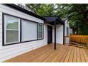 Cozy front porch featuring a freshly painted exterior, and a modern front door that welcomes visitors at 2736 Joyce Ave, Decatur, GA 30032