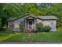 Inviting single-story home with beautiful curb appeal and a well-manicured lawn at 842 Third St, Stone Mountain, GA 30083
