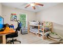 Cozy bedroom with a window view and a wooden bunkbed set, desk and swivel chair at 561 Holland Rd, Dallas, GA 30157