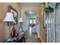Inviting foyer with hardwood floors and elegant decor creating a warm welcome at 3393 Sardis Bend Dr, Buford, GA 30519