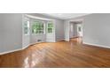 Bright living room with large windows, hardwood floors, and neutral paint at 4197 Chadds Xing, Marietta, GA 30062