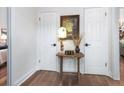 Hallway with hardwood floors, a vintage table, and unique decor at 666 Serramonte Drive Dr, Marietta, GA 30068