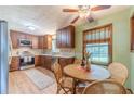 Eat-in kitchen featuring wooden cabinets, stainless steel appliances, and a breakfast nook at 2863 Jordan Forest Trl, Lawrenceville, GA 30044