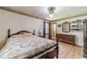 Comfortable main bedroom featuring hardwood floors, natural light, and traditional furnishings at 2863 Jordan Forest Trl, Lawrenceville, GA 30044