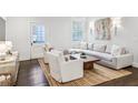 Bright living room with hardwood floors, comfortable seating, and lots of natural light at 68 Peachtree Memorial Nw Dr # 68-1, Atlanta, GA 30309