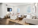 Bright living room with hardwood floors, comfortable seating, and lots of natural light at 68 Peachtree Memorial Nw Dr # 68-1, Atlanta, GA 30309