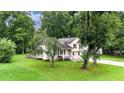 Charming split-level home nestled in a serene wooded area, with a spacious lawn at 132 Bishop Nw Rd, Cartersville, GA 30121