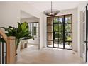 Inviting foyer with large windows, a stylish light fixture, and elegant hardwood flooring at 3292 Lenox Ne Pl, Atlanta, GA 30324