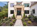 Gorgeous stone front entrance with professionally landscaped walkway and well-maintained bushes at 3292 Lenox Ne Pl, Atlanta, GA 30324