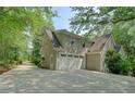 Spacious home featuring a three car garage and extra space for parking at 13935 Brown Bridge Rd, Covington, GA 30016