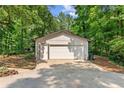 Spacious two-car garage with a double door, offering ample parking and storage at 4025 Demooney Rd, Atlanta, GA 30349