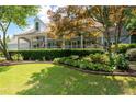 Charming home with a covered porch and professionally landscaped front yard at 2915 Preakness Nw Dr, Marietta, GA 30064