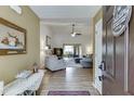 Open-concept living room featuring hardwood floors and neutral paint at 992 Harbins Pass Dr, Dacula, GA 30019