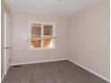 A bedroom featuring neutral walls and carpet flooring at 1421 Dennis Dr, Decatur, GA 30032