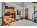 Open-concept living space with a view of the kitchen and a spiral staircase at 30 5Th Ne St # 1006, Atlanta, GA 30308