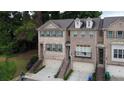 Charming brick townhome with two-car garage and well-maintained landscaping in a desirable neighborhood at 1949 Townsend Ne Ct # 22, Atlanta, GA 30329