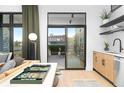 View from a well-lit modern living space looking out onto a sunny patio space at 567 Ponce De Leon Ne Ave # 606, Atlanta, GA 30308