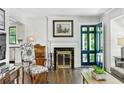 Bright living room with hardwood floors, fireplace, and stylish doorway at 111 Terrace Ne Dr, Atlanta, GA 30305
