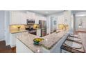 Modern kitchen featuring stainless steel appliances, granite countertops, and ample cabinet space at 2245 Long Bow Chase, Kennesaw, GA 30144