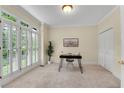 Bright office space featuring natural light, plantation shutters, and neutral carpet at 1548 Valley Reserve Court, Kennesaw, GA 30152