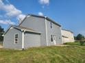 Exterior home view shows backyard with full siding, fencing, and partial blue sky at 170 Inverness Trce, Riverdale, GA 30274