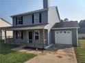 Charming two-story home with a cozy front porch and attached one-car garage at 170 Inverness Trce, Riverdale, GA 30274