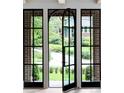 View from inside the house looking to the beautifully landscaped front yard at 1026 Reeder N Cir, Atlanta, GA 30306