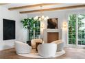 Cozy sitting area featuring four chairs, fireplace, and bright windows at 1026 Reeder N Cir, Atlanta, GA 30306