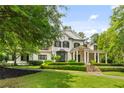 Beautiful two-story home with lush green lawn and mature trees at 980 Fenimore Cir, Atlanta, GA 30350