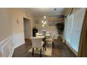 Bright dining room with elegant table setting, large windows, and stylish decor at 1008 Post Horn Run, Lawrenceville, GA 30045