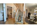Elegant entryway with staircase leading to the second floor, beautiful floors and neutral walls at 1008 Post Horn Run, Lawrenceville, GA 30045