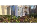 Exterior view showcasing balconies and lush greenery at 1638 Raleigh Cir, Marietta, GA 30067