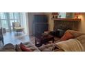 Comfortable living room features a stone fireplace, wood floors, and modern furnishings at 1638 Raleigh Cir, Marietta, GA 30067