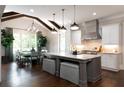 Modern kitchen featuring a large island, stainless steel appliances, and an adjacent dining area at 2909 Redding Road Northeast, Atlanta, GA 30319