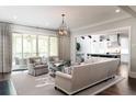 Open-concept living room with hardwood floors and sliding glass doors to the outside at 2909 Redding Road Northeast, Atlanta, GA 30319