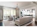 Bright living room with hardwood floors, modern furnishings, and a view of the back porch at 2909 Redding Road Northeast, Atlanta, GA 30319