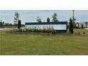 Walden Park community sign on a sunny day with a large green lawn at 1346 Riverstone Rd # 107, Jonesboro, GA 30238